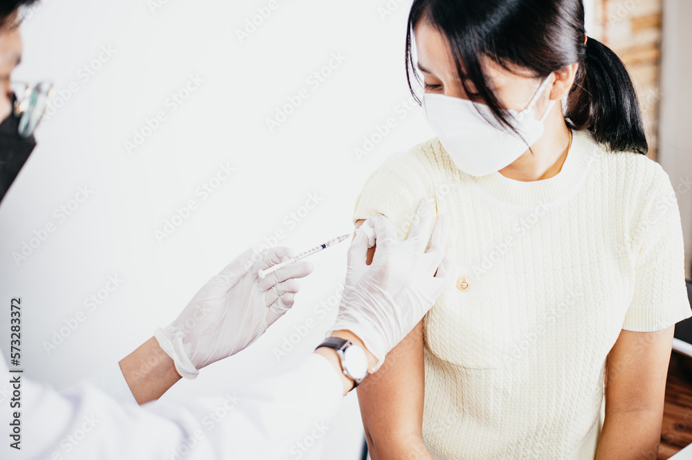 Doctor in medical gloves giving of flu patients Doctor in medical gloves giving of flu patients
