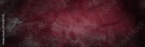 Dark abstract dark red concrete paper texture background banner pattern. Backdrop red grunge background with space for text or image.