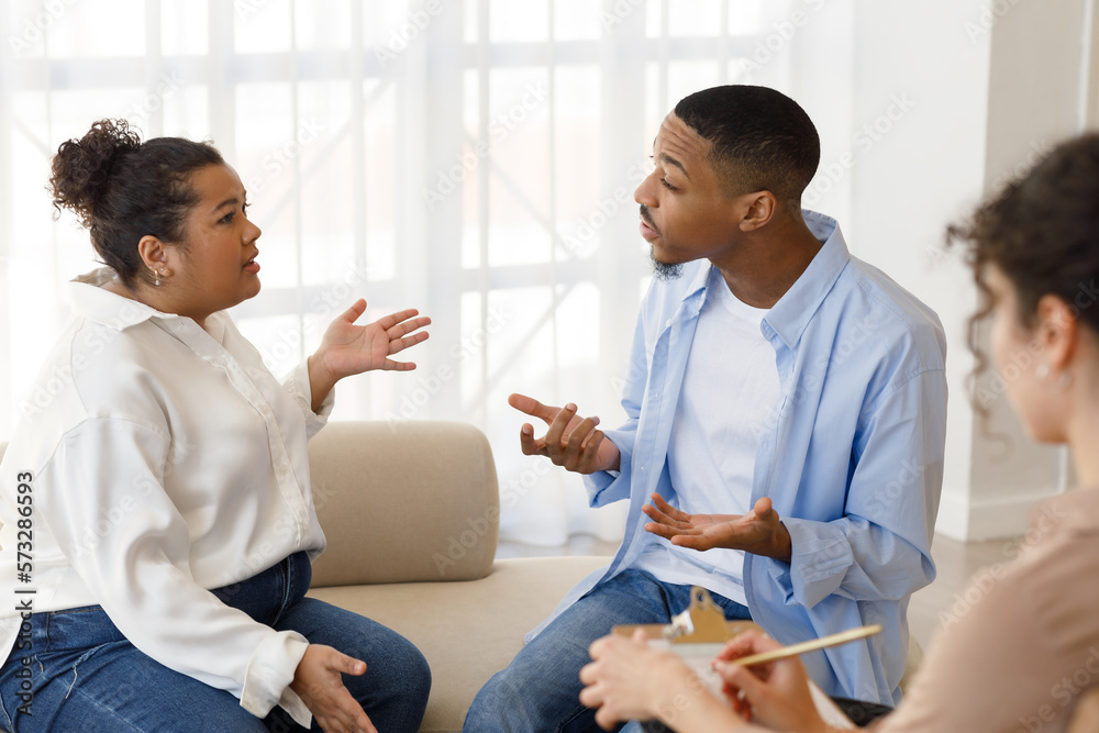 Hysterical mixed race spouses fight at family counselor office Hysterical mixed race spouses fight at family counselor office