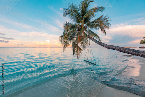 Fototapeta Naklejka Na Ścianę i Meble -  Relax vacation leisure lifestyle on exotic tropical island beach, palm tree hammock hanging calm sea. Paradise beach landscape, water villas, sunrise sky clouds amazing reflections. Beautiful nature
