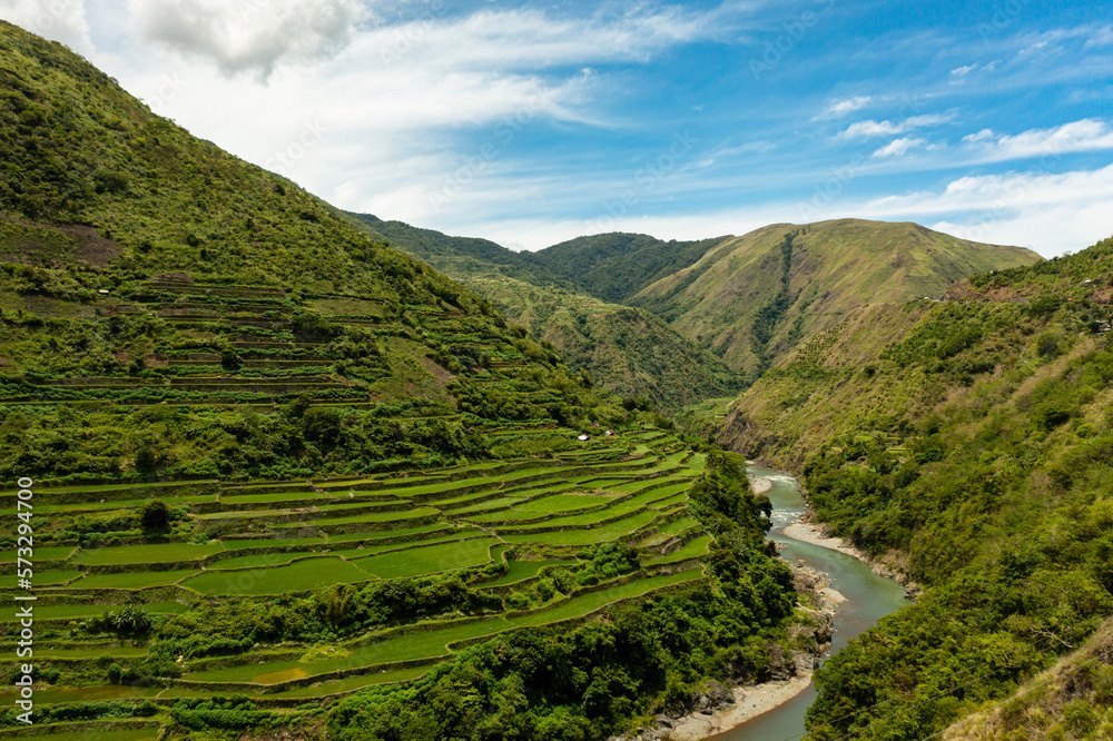 Aerial view of mountains and rice fields against the blue sky. Philippines, Luzon. Aerial view of mountains and rice fields against the blue sky. Philippines, Luzon.