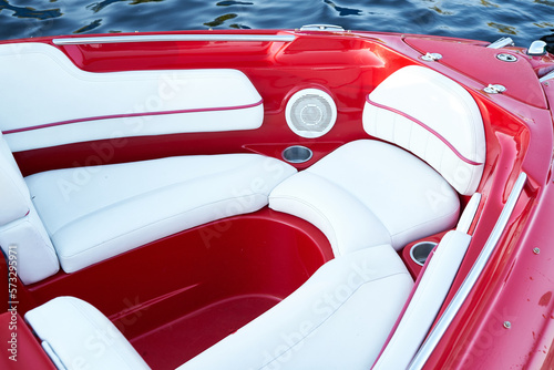 Сlose-up of the red speedboat bow with white leather seats                             photo