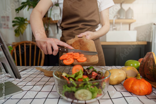 Young Healthy woman cooking healthy food in the kitchen at home. Healthy lifestyle  food  diet concept.