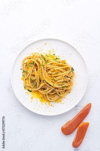 Wallpaper Mural Spaghetti pasta with bottarga (dried tuna or mullet caviar) on a white table. Classic sea dish of Sardinia and Sicilly islands. Italian healthy cuisine
 Torontodigital.ca