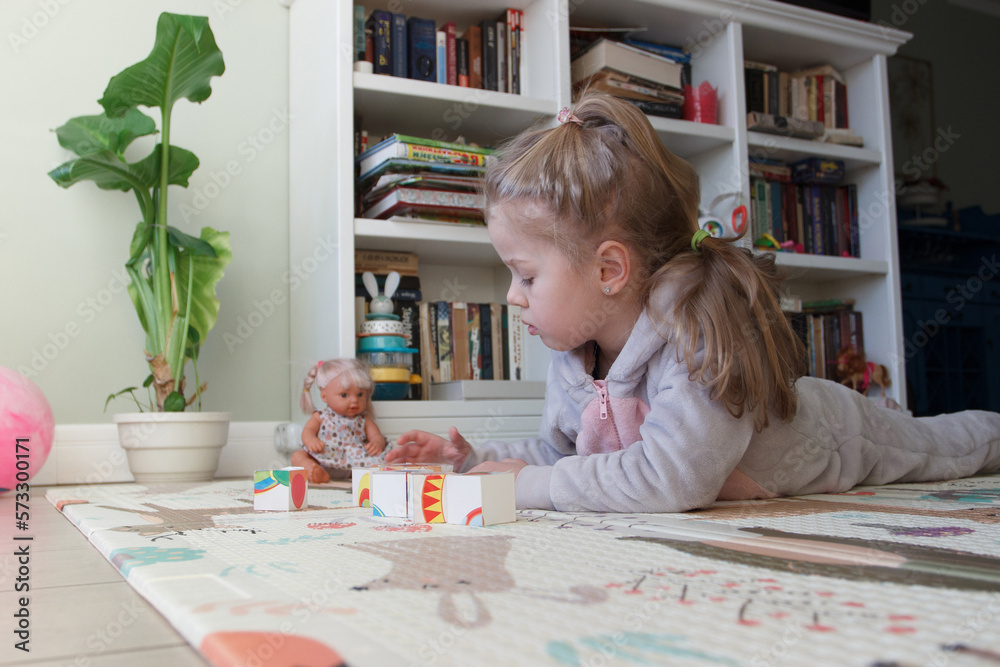 Little cute girl spending time in the playroom Little cute girl spending time in the playroom