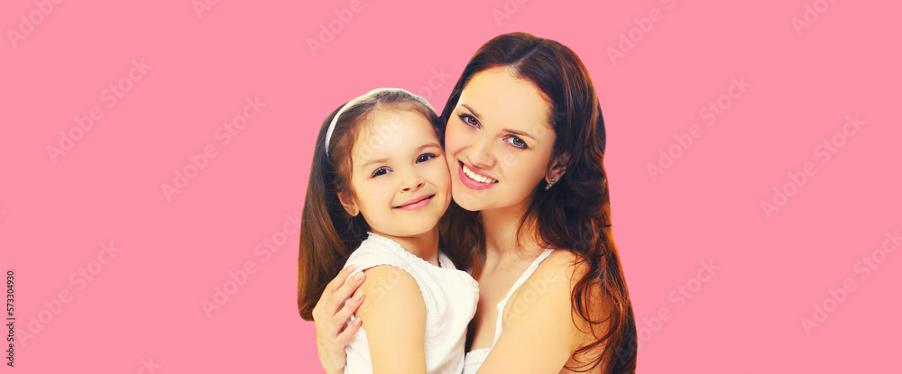 Portrait of happy smiling mother with daughter child on pink background Portrait of happy smiling mother with daughter child on pink background