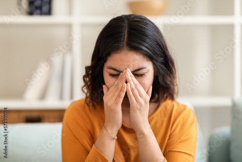 Closeup Portrait Of Young Arab Woman Crying At Home