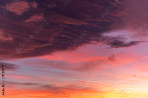 Huge orange cloud in the sky at sunset. © bios48