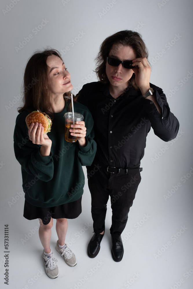 boy and girl eating burger