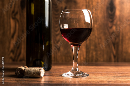 Bottle for wine with a glass and corks