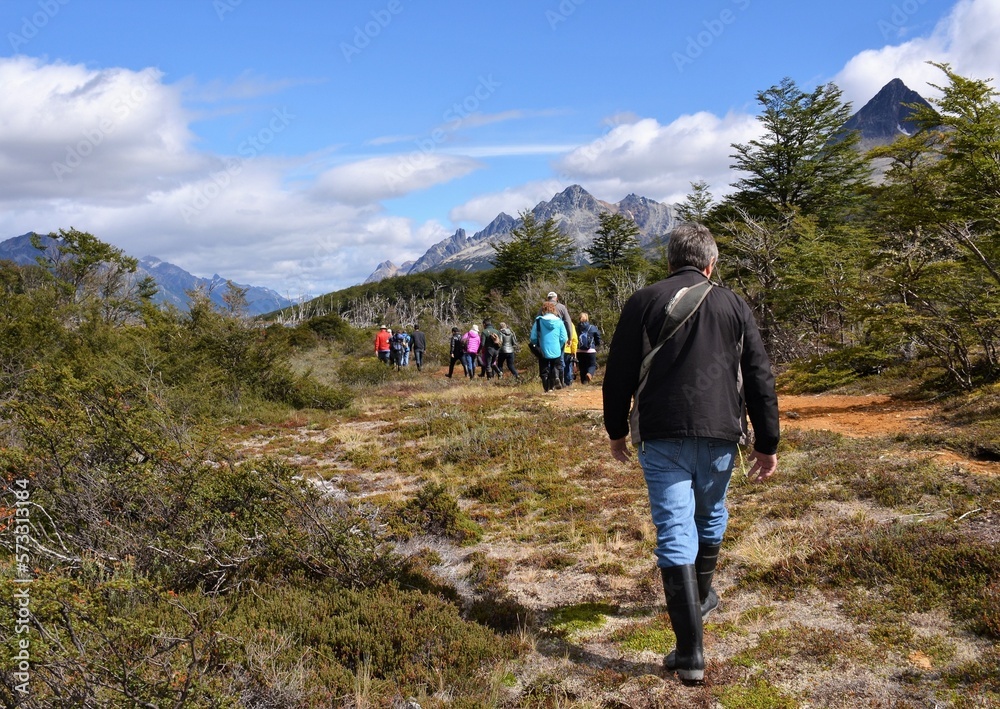A group of tourists hike through the peat bogs of Tierra Del Fuego National Park at the southern tip of South America