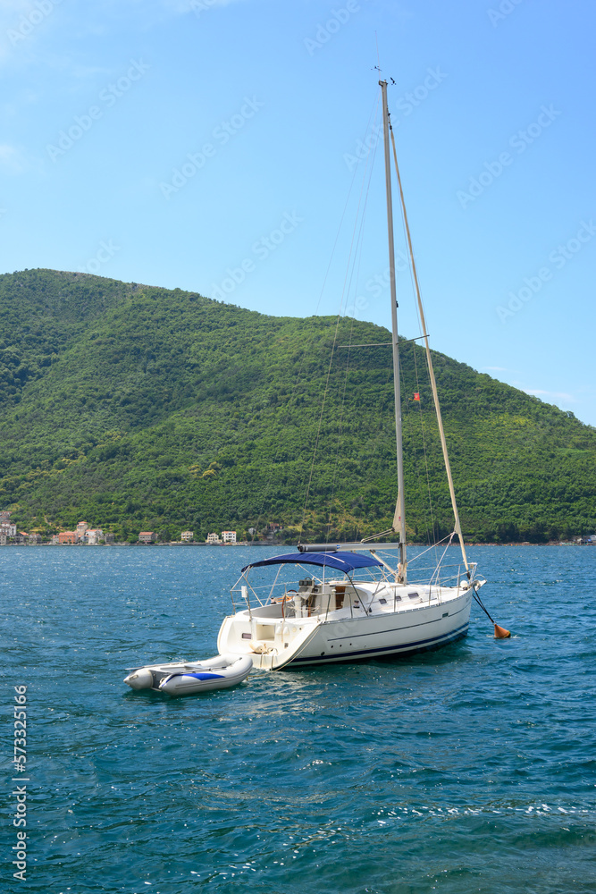 Yacht moored in Kotor Bay. Picturesque views in Montenegro Yacht moored in Kotor Bay. Picturesque views in Montenegro