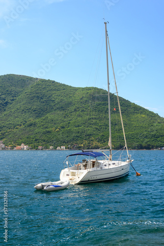 Yacht moored in Kotor Bay. Picturesque views in Montenegro