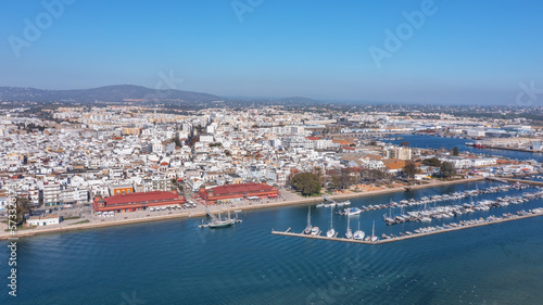 Aerial view of the Portuguese fishing tourist town of Olhao overlooking the Ria Formosa Marine Park. sea port for yachts and Municipal market