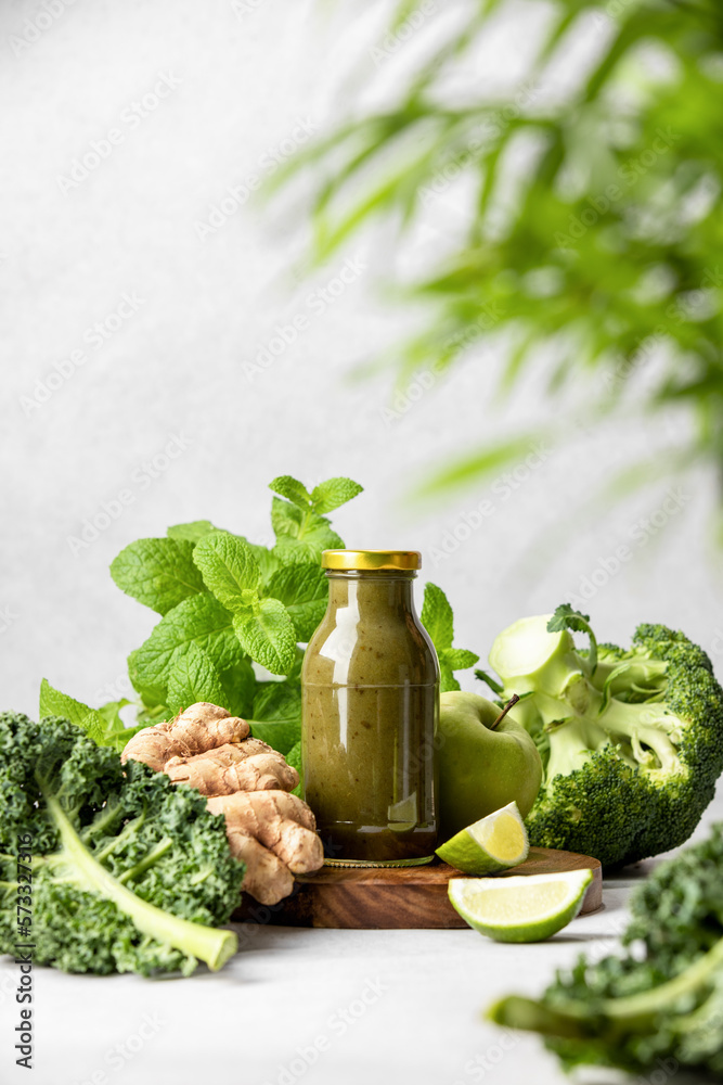Fotografie Green vegetables smoothies in a bottle, front view