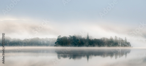 Very misty dawn over still lake Derwentwater © Simon