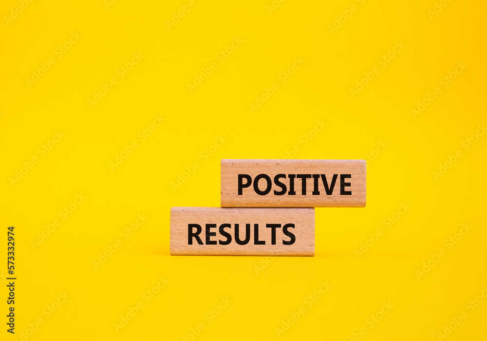 Positive results symbol. Concept words 'Positive results' on wooden blocks. Beautiful yellow background. Business and Positive results concept. Copy space. Positive results symbol. Concept words 'Positive results' on wooden blocks. Beautiful yellow background. Business and Positive results concept. Copy space.