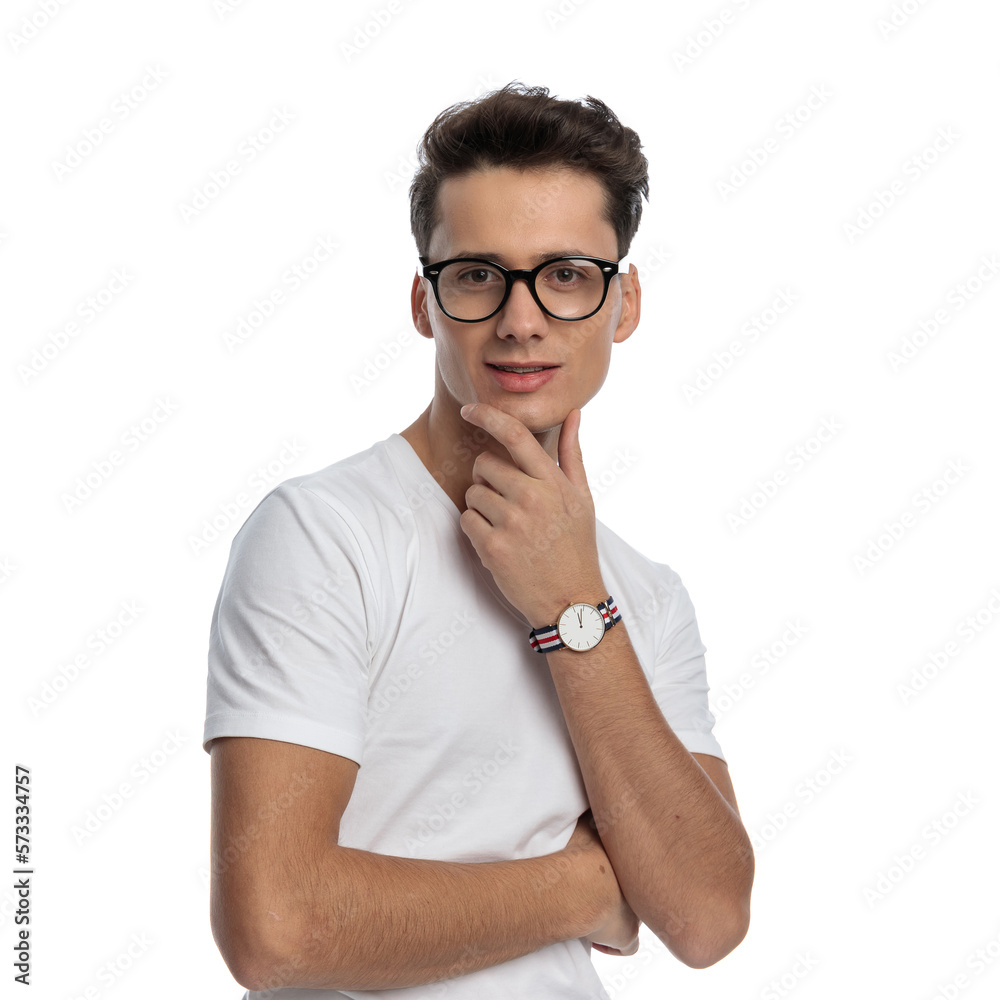 portrait of handsome man with glasses holding hand to chin and thinking portrait of handsome man with glasses holding hand to chin and thinking
