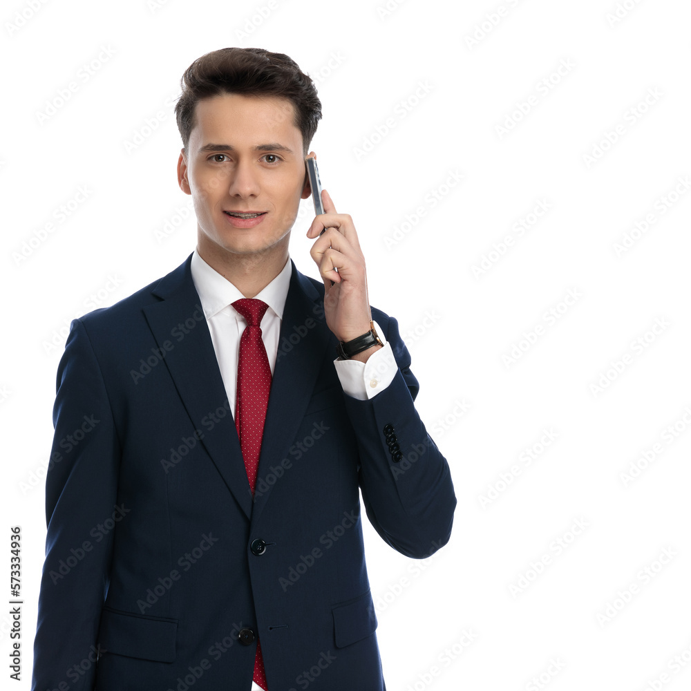 businessman talking on the phone and smiling businessman talking on the phone and smiling