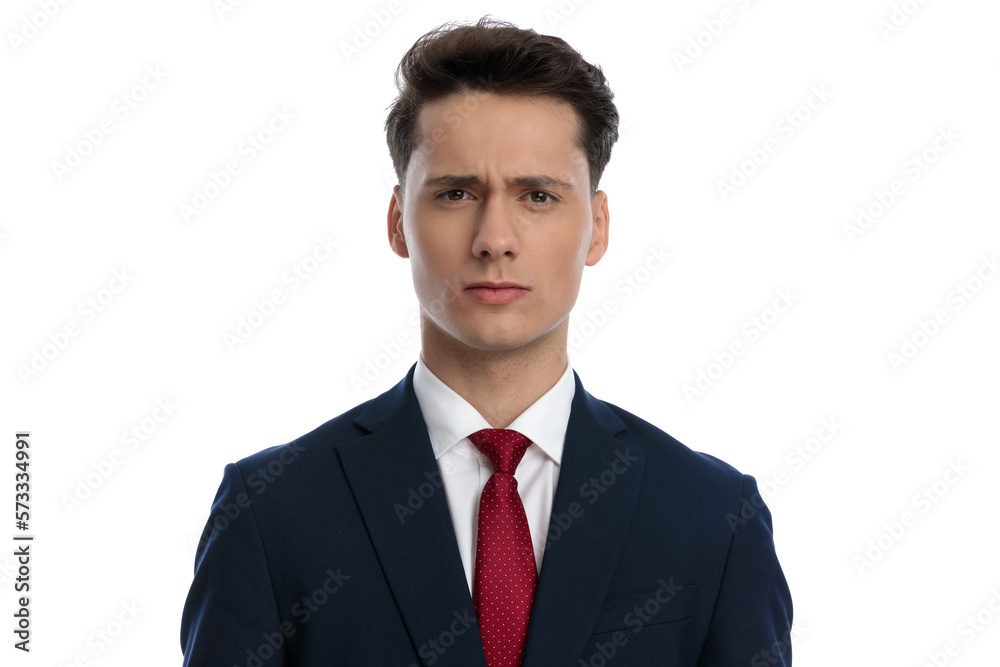 businessman posing with a tough look on his face businessman posing with a tough look on his face