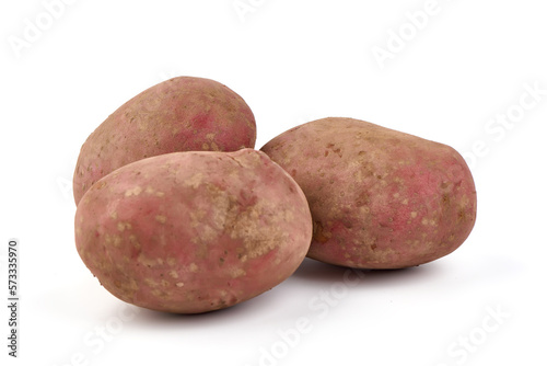 Unwashed potatoes, isolated on white background.