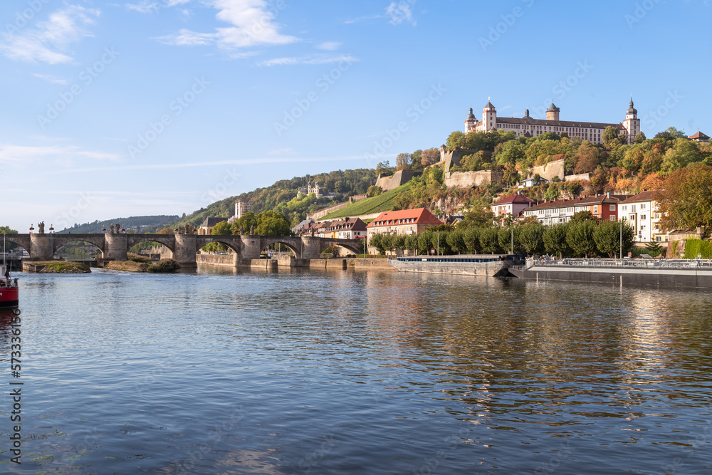 Main river with a view of the medieval bridge, Alte mainbrücke and fortress Marienberg in the historic city of Wurzburg, Bavaria; Germany.
