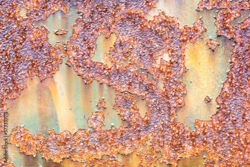 Rust covering a green metal surface on an vintage digging machine photo