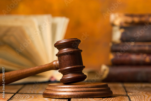 Law and justice concept. Mallet gavel of the judge, scales of justice, books. Copy space for text