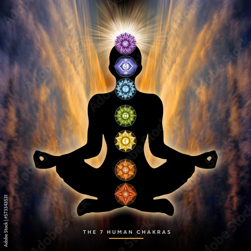 Human silhouette in yoga, lotus pose with 7 Chakras on mystical sunset background. Human energy body, Aura. Supportive poster for meditation and chakra energy healing.