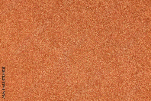 Orange plastered wall. Texture, background, free space for text. High resolution