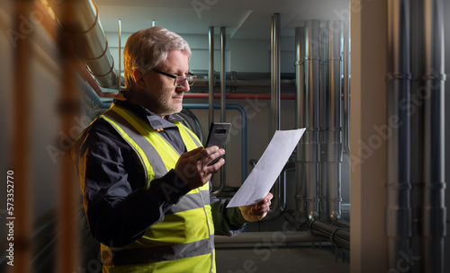 Man maintains boiler equipm...