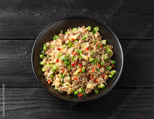 Asian Beef Fried Rice with eggs and vegetables in black bowl