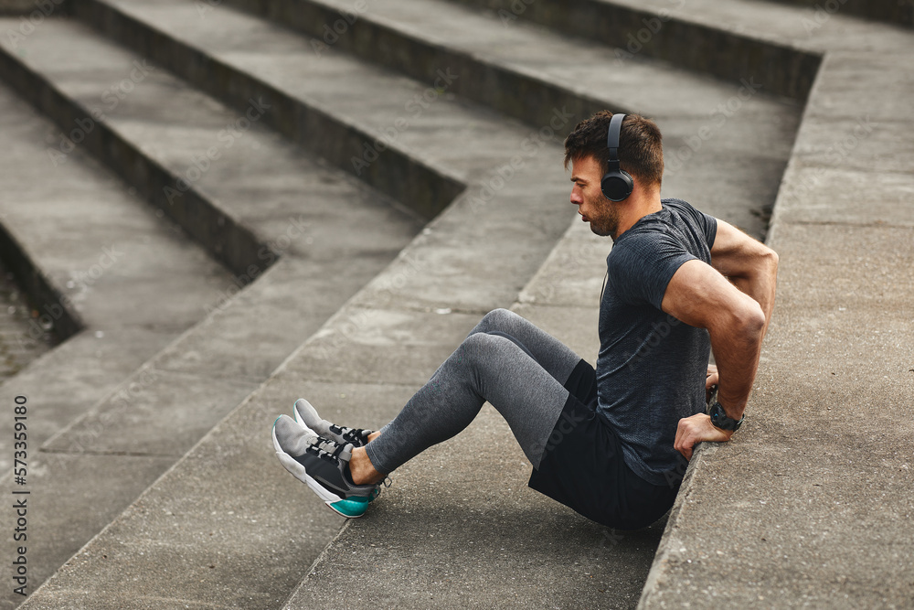 Young fit man workout outdoors on concrete steps Young fit man workout outdoors on concrete steps