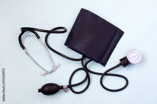 Sphygmomanometer. Mechanical tonometer for non-invasive measurement of blood pressure on blue background. device for diagnosing cardiovascular diseases. Medicine. Health care.