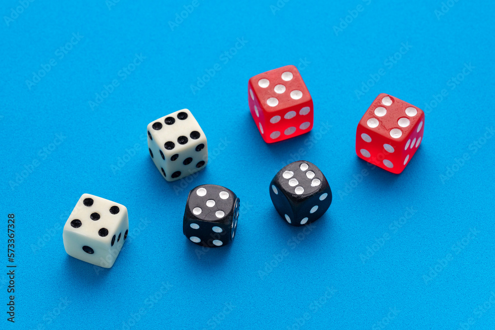 Dice for board game on blue background - Entertainment in casino Dice for board game on blue background - Entertainment in casino