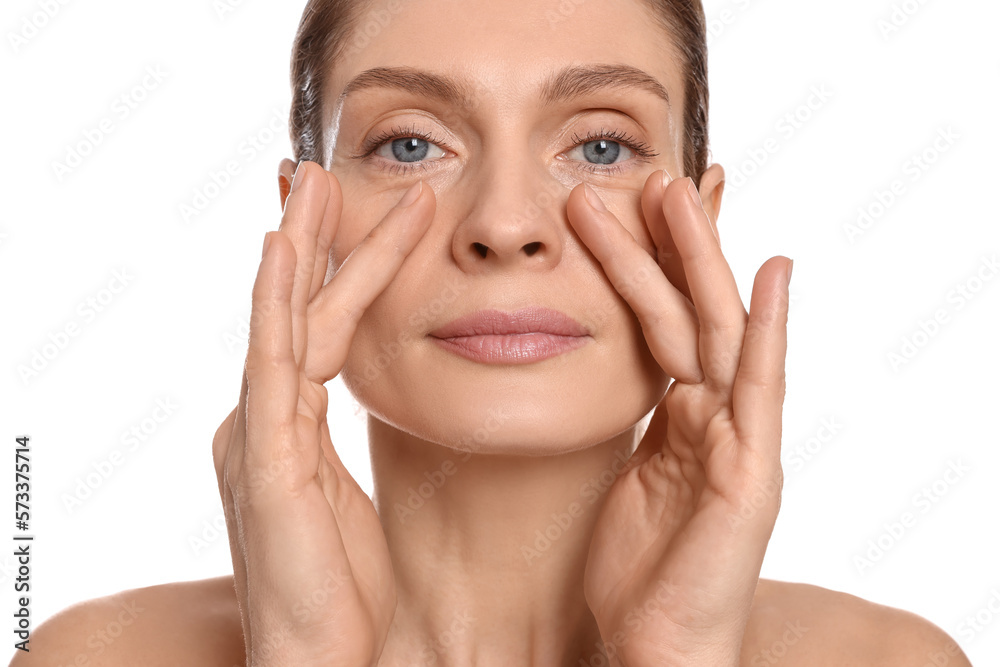Woman massaging her face on white background Woman massaging her face on white background