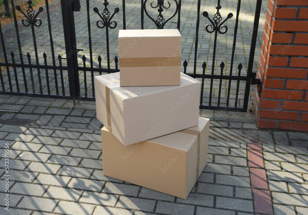 Stack of parcels delivered near front gates Stack of parcels delivered near front gates