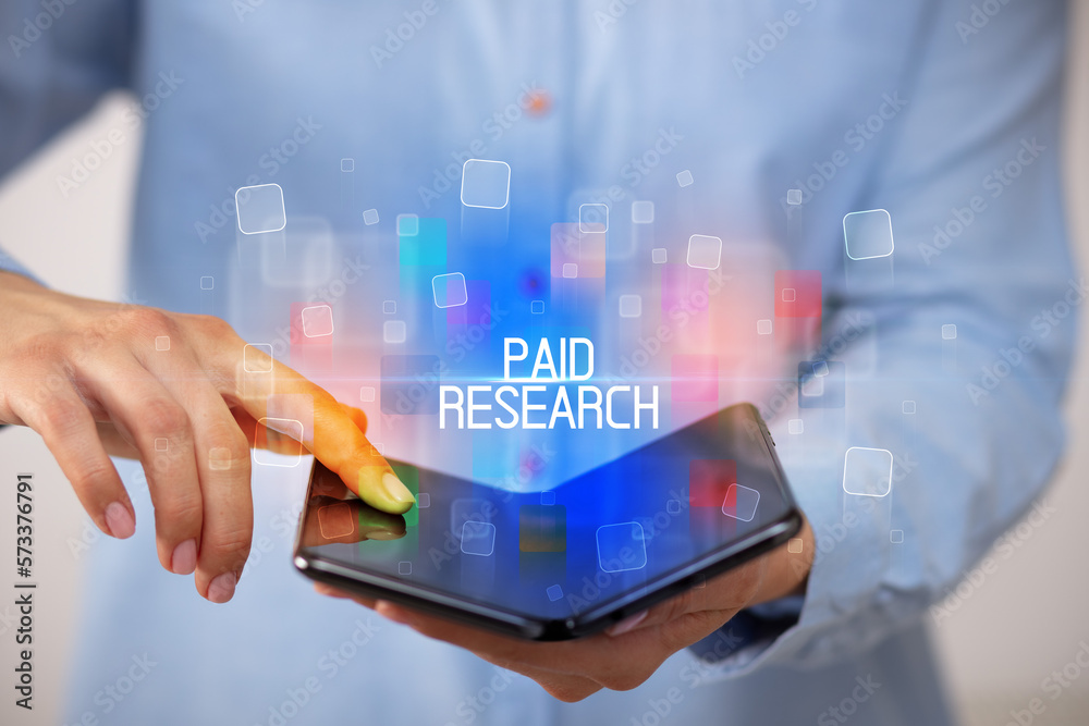 Young man holding a foldable smartphone