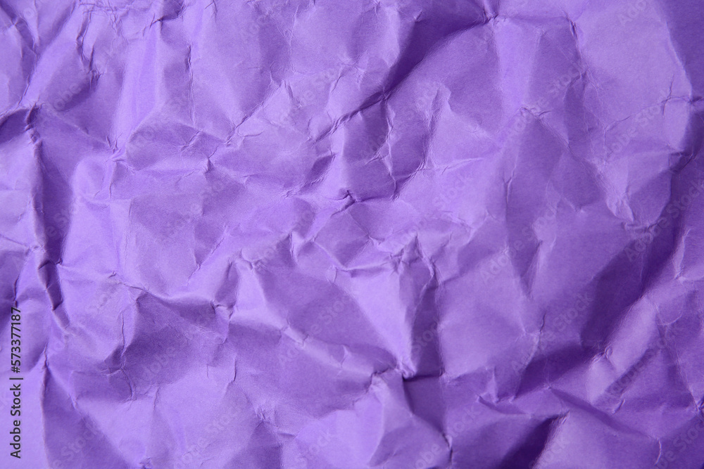 Sheet of crumpled violet paper as background, top view