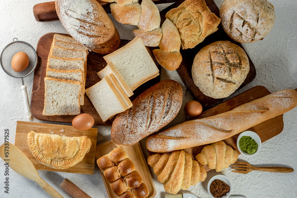 Mix bread kind of cereal bakery yeast white bread, pasties, buns, rye pretzel sourdough leavened tortilla and croissant on old wooden background. Mix bread kind of cereal bakery yeast white bread, pasties, buns, rye pretzel sourdough leavened tortilla and croissant on old wooden background.