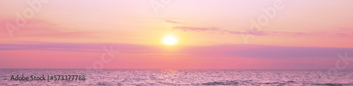 Beautiful panorama of sky over sea at sunset. Banner design