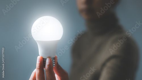 Photos Electric led light blub in hand
