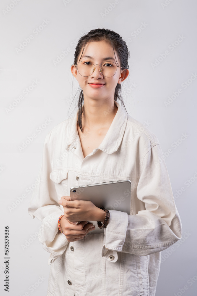 Young beautiful woman using smartphone gadget ipad.Lifestyle concept. Isolated on white background. Young beautiful woman using smartphone gadget ipad.Lifestyle concept. Isolated on white background.