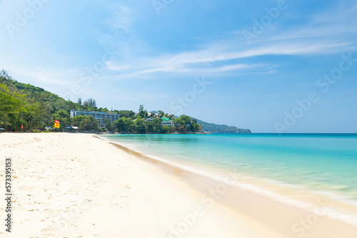 Long exposure shot of Surin beach with blue sky during a sunny day, one of the tourist destination in Phuket, Thailand