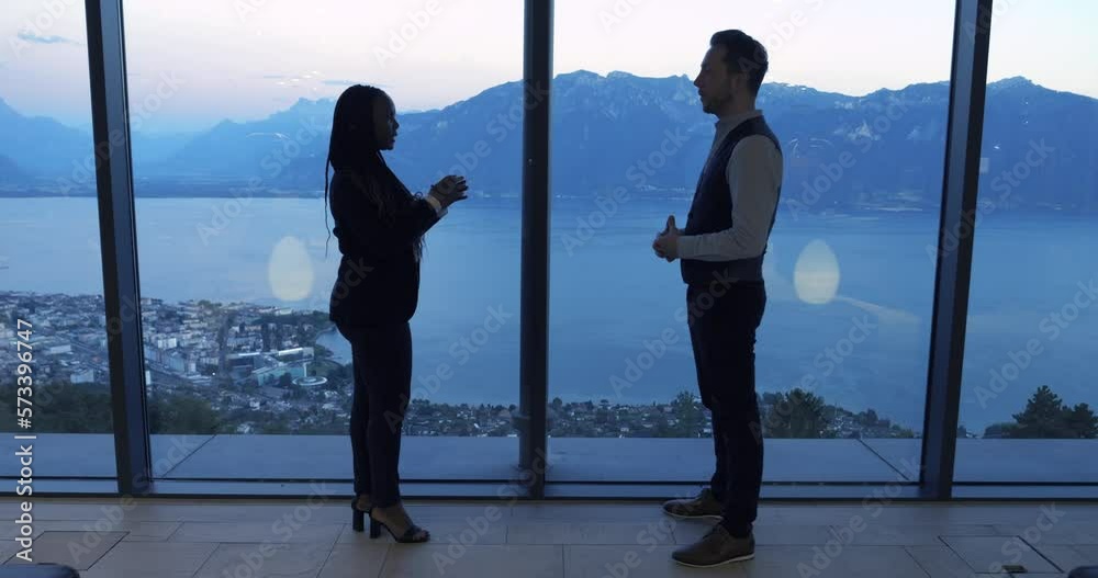 Two Young Business People Meeting Talking About Finance Corporate Sales Deal Agreement Inside Modern Building Two Young Business People Meeting Talking About Finance Corporate Sales Deal Agreement Inside Modern Building