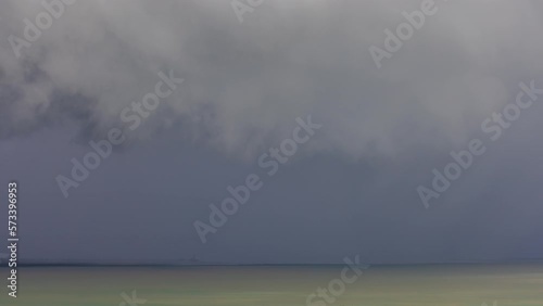 Timelapse of afternoon monsoon storm as its rolling over Darwin Harbour, during the wet season in the afternoon photo