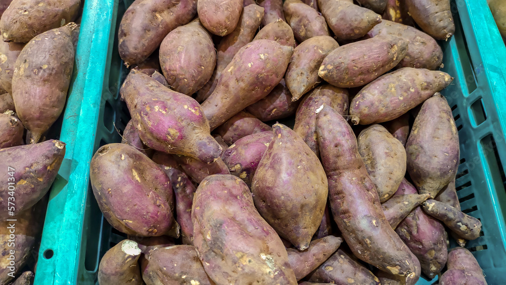 Group of sweet potatoes for sell in market Group of sweet potatoes for sell in market