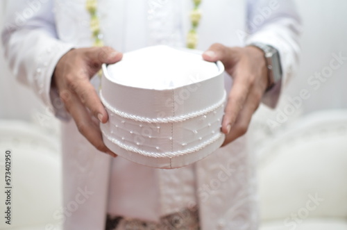 close up of a bride holding a skullcap