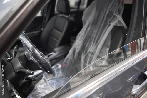 Put on protective covers when taking the car in service. Steering wheel with protective cover on. Car pre-sale