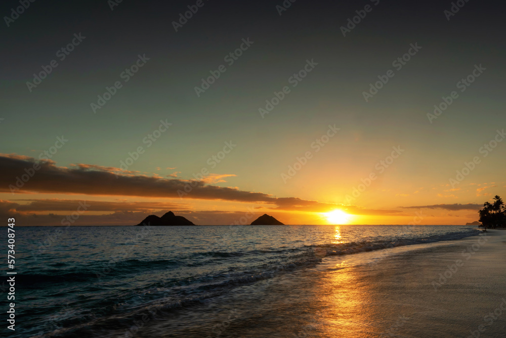 Sunrise scene at Lanikai Beach in Kailua, Hawaii.  Lanikai is regularly ranked among the top beaches in the world